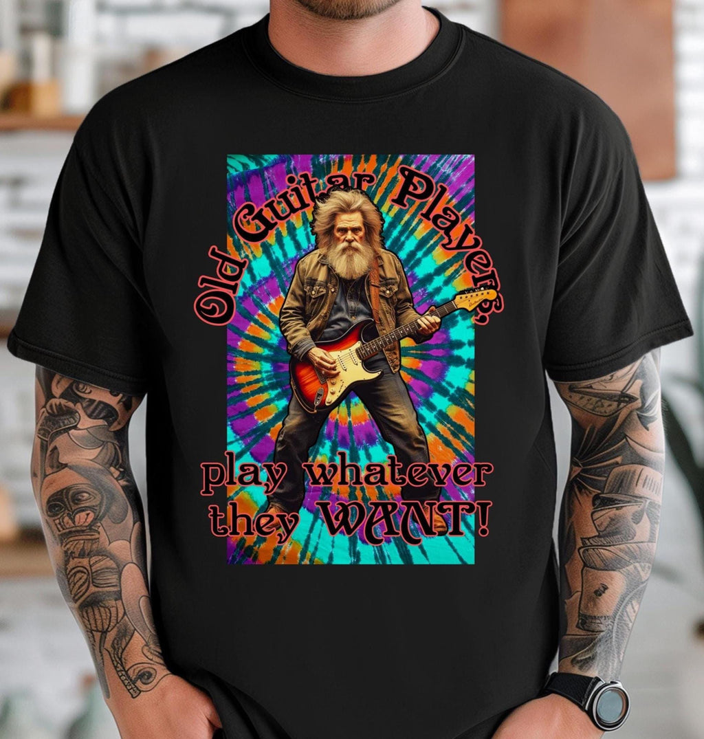 Black t-shirt with a colorful graphic of a man playing guitar and text 'Old Guitar Player play whatever they WANT!'.